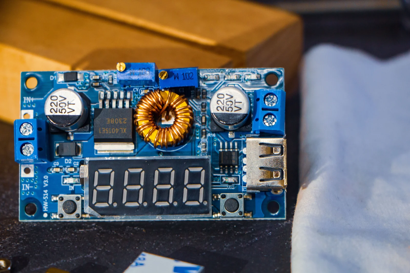 A beautifully crafted ceramic circuit board with green elements.