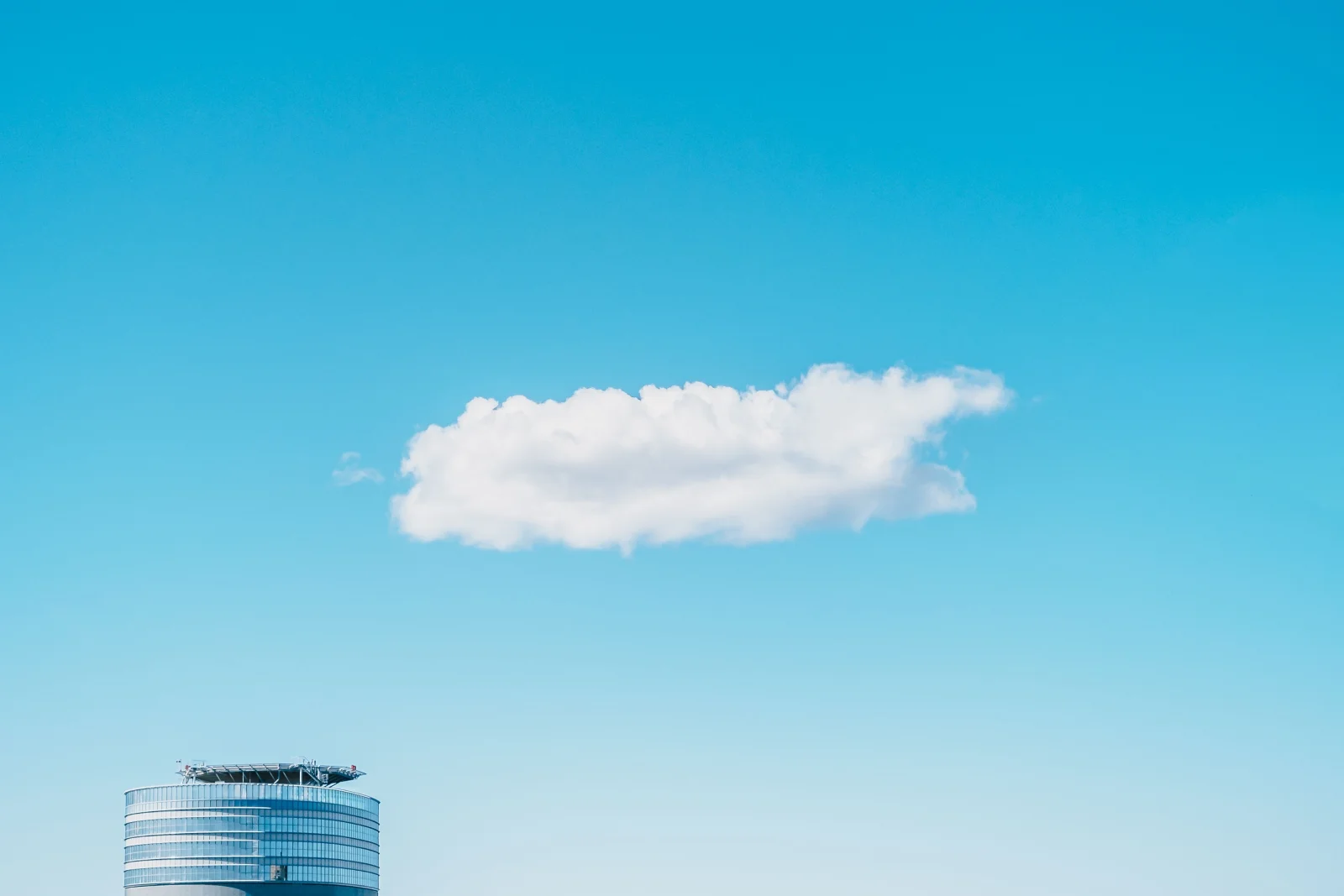 A dramatic skyline depicting the digital cloud and physical servers