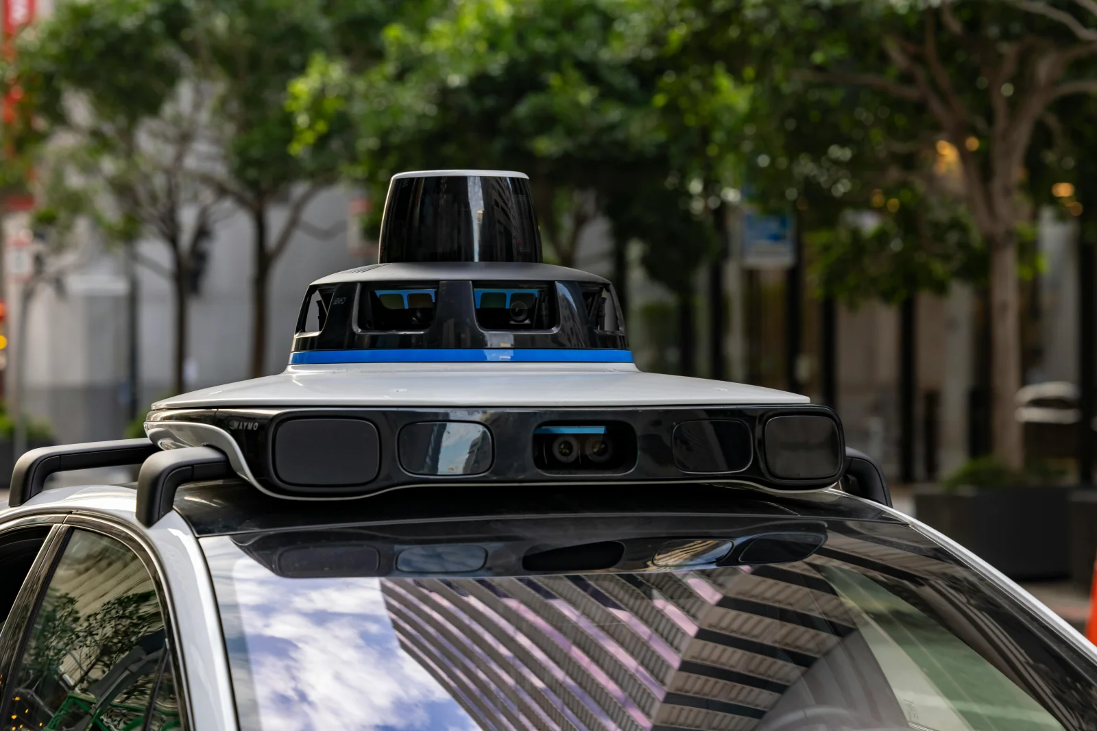 Uber cars navigating through a cityscape, capturing data.